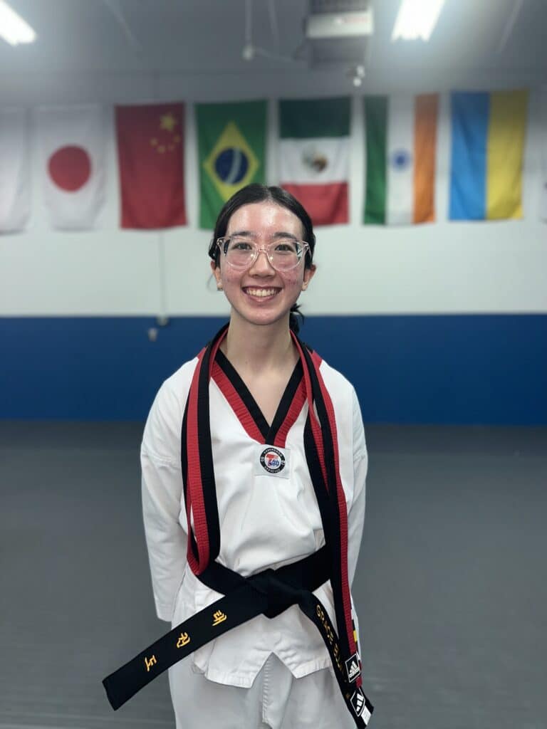 Akula Taekwondo member in white gi.